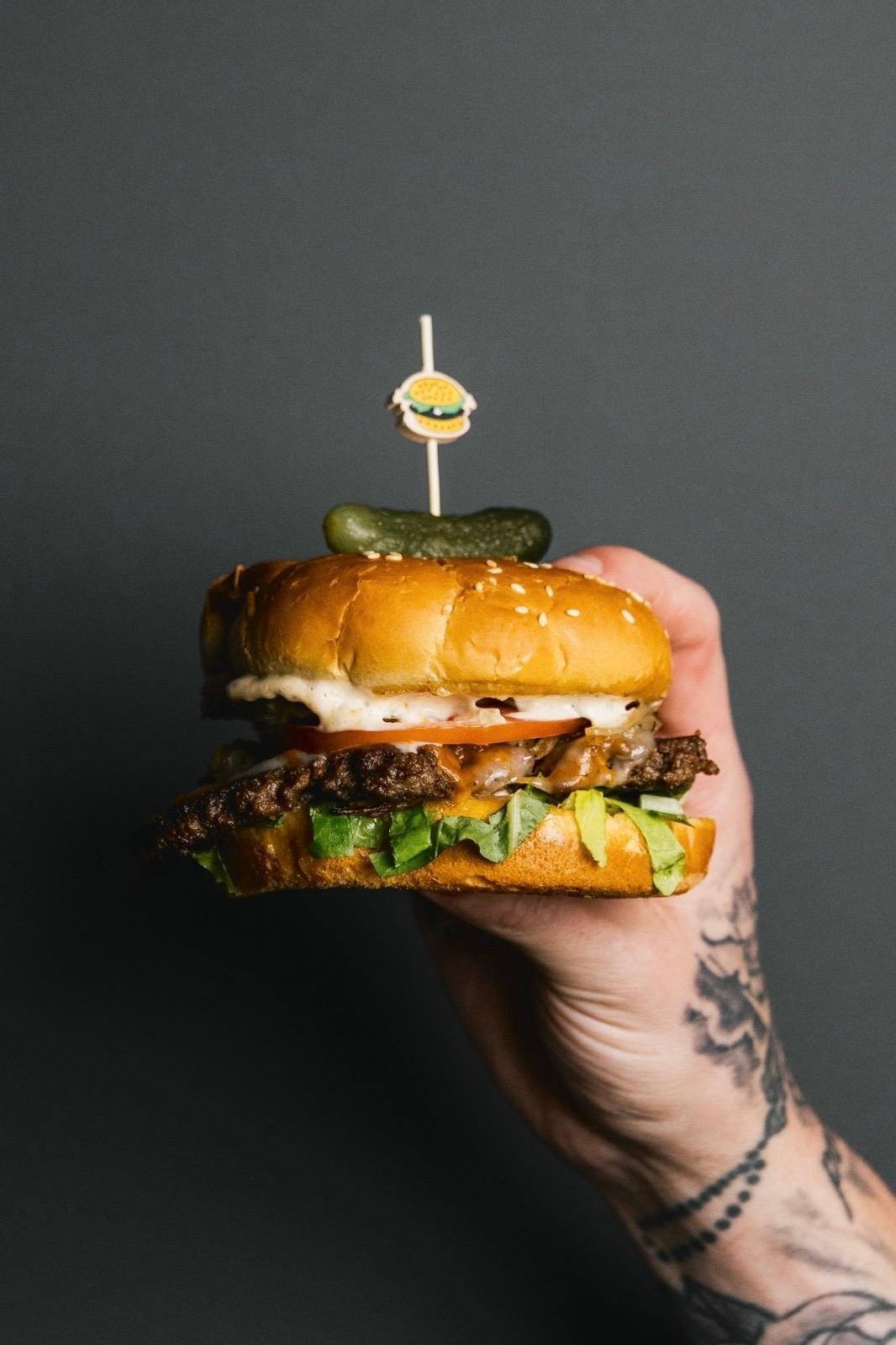 Signature flame-grilled burger at Kensington Socials Toronto